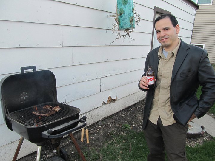 Hector watching over the steak during my graduation party in 2011. We already had bellies full of beer, chorizos and chicken by then. Como Dios manda.